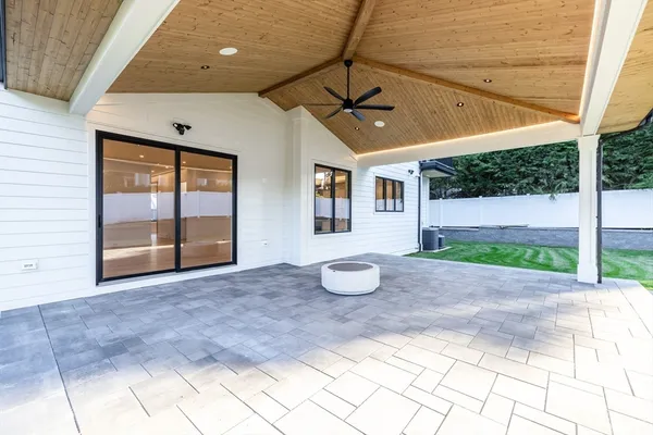 a view of a livingroom with a patio and a garden