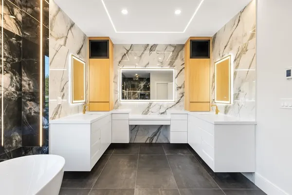 a bathroom with a sink a mirror and a bathtub