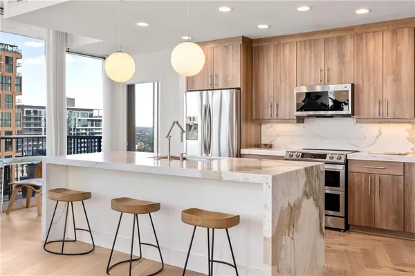 a view of a dining room with furniture and chandelier