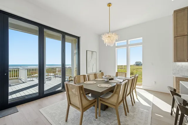a bathroom with a granite countertop sink a toilet a mirror and shower