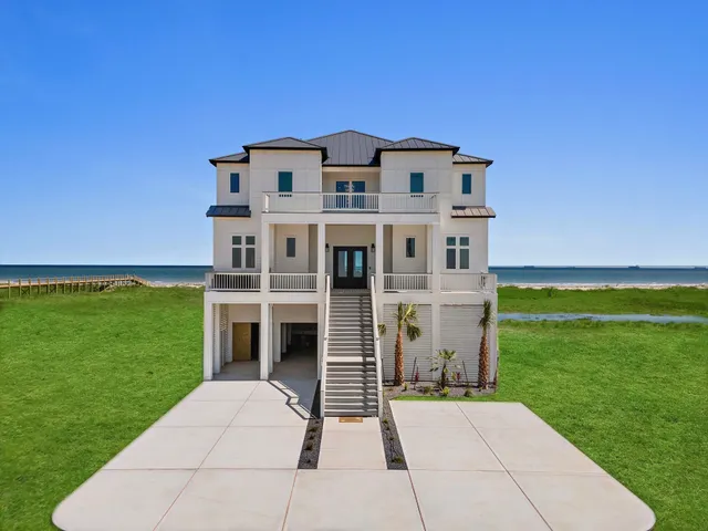 a living room with furniture ceiling fan and a large window