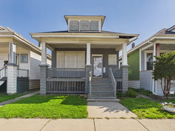front view of a house with a small yard