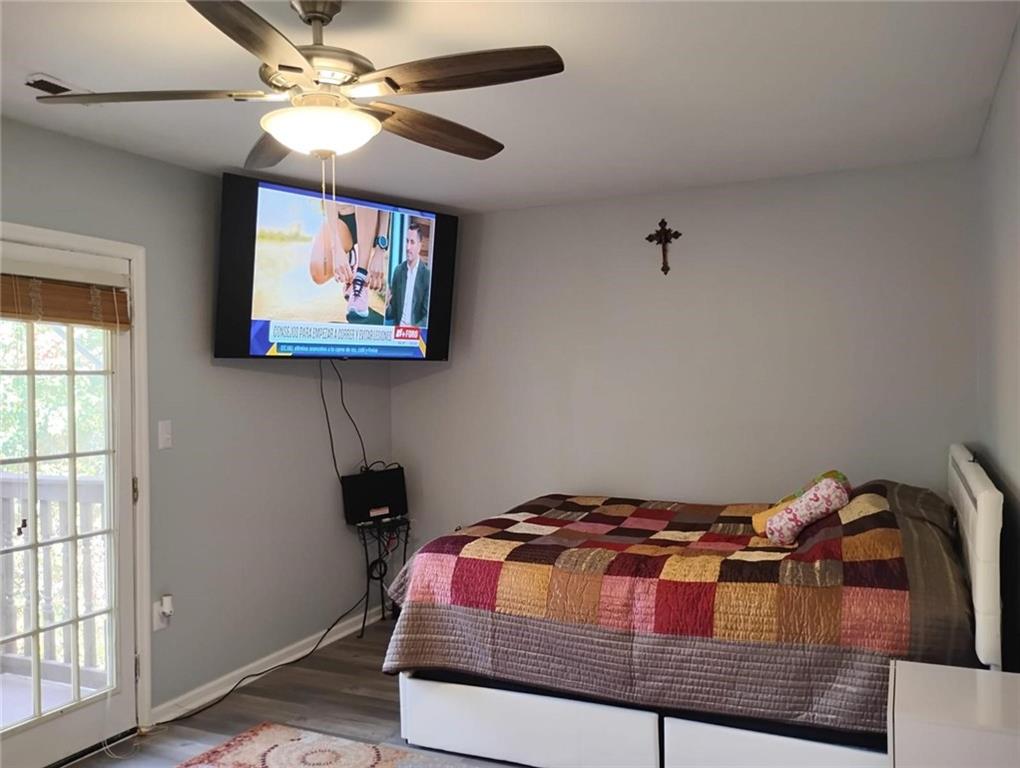 3073 Shadow Walk Lane Tucker, GA 30084 - Photo 13 of 48 a bedroom with a bed and a chandelier