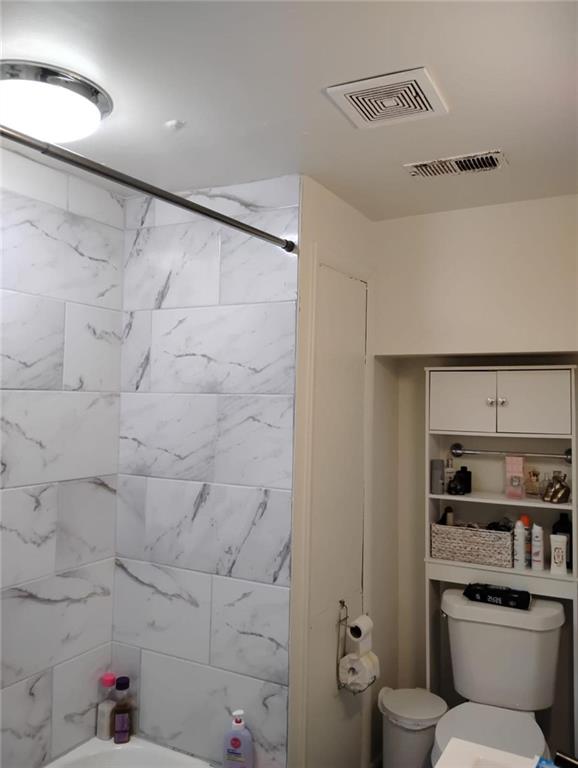 3073 Shadow Walk Lane Tucker, GA 30084 - Photo 16 of 48 a bathroom with a toilet sink and shower