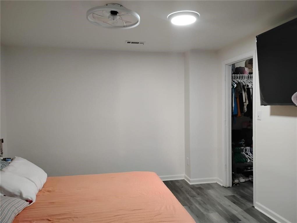 3073 Shadow Walk Lane Tucker, GA 30084 - Photo 19 of 48 a bedroom with a bed and a flat screen tv