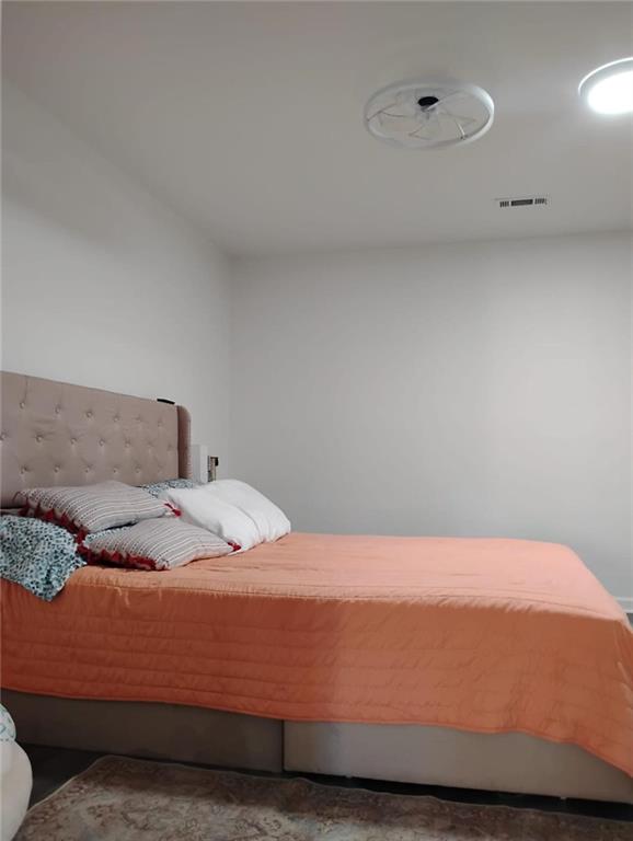 3073 Shadow Walk Lane Tucker, GA 30084 - Photo 21 of 48 a bedroom with a bed and a night stand