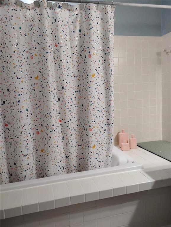 3073 Shadow Walk Lane Tucker, GA 30084 - Photo 27 of 48 a bathroom with a bathtub and shower