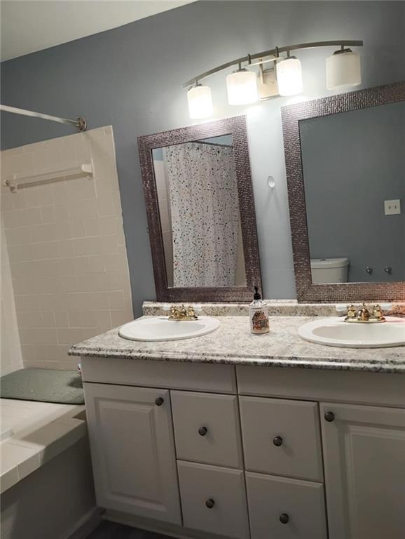 3073 Shadow Walk Lane Tucker, GA 30084 - Photo 29 of 48 a bathroom with a granite countertop sink and a mirror