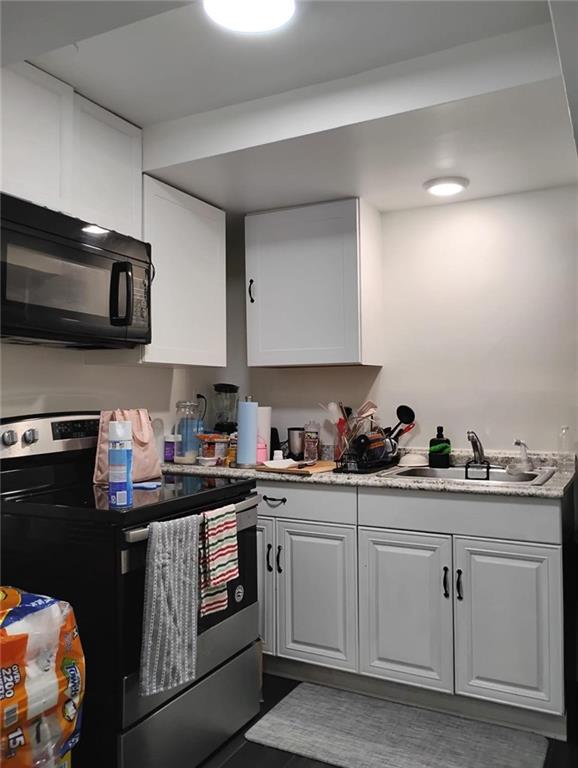 3073 Shadow Walk Lane Tucker, GA 30084 - Photo 6 of 48 a kitchen with a sink stove and microwave