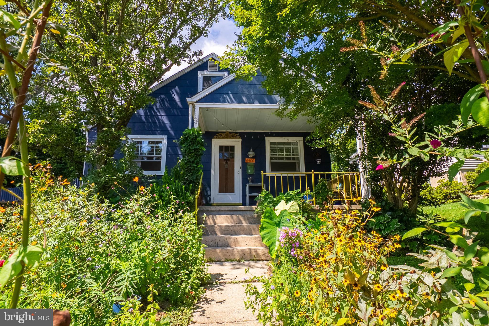 6400 Crestwood Road Baltimore, MD 21239 - Photo 1 of 39 a front view of a house with a garden