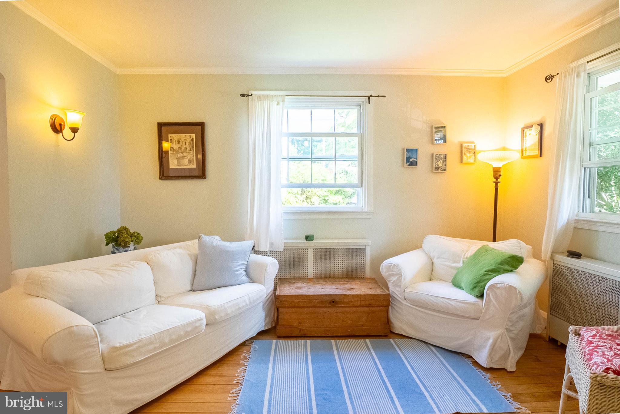 6400 Crestwood Road Baltimore, MD 21239 - Photo 16 of 39 a living room with furniture and a window