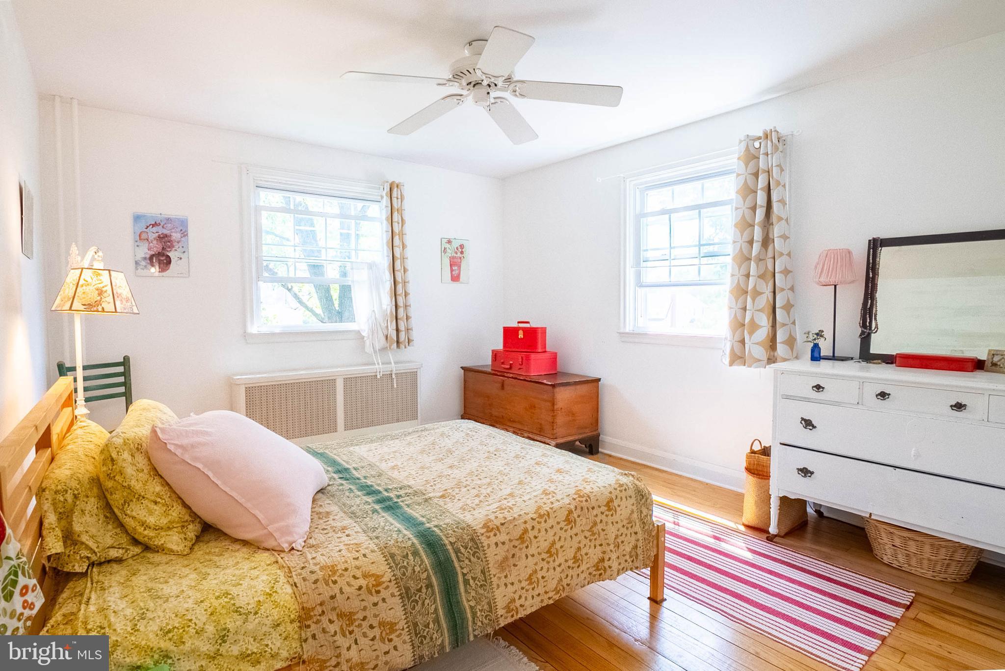 6400 Crestwood Road Baltimore, MD 21239 - Photo 24 of 39 a bedroom with a bed and a dresser in it