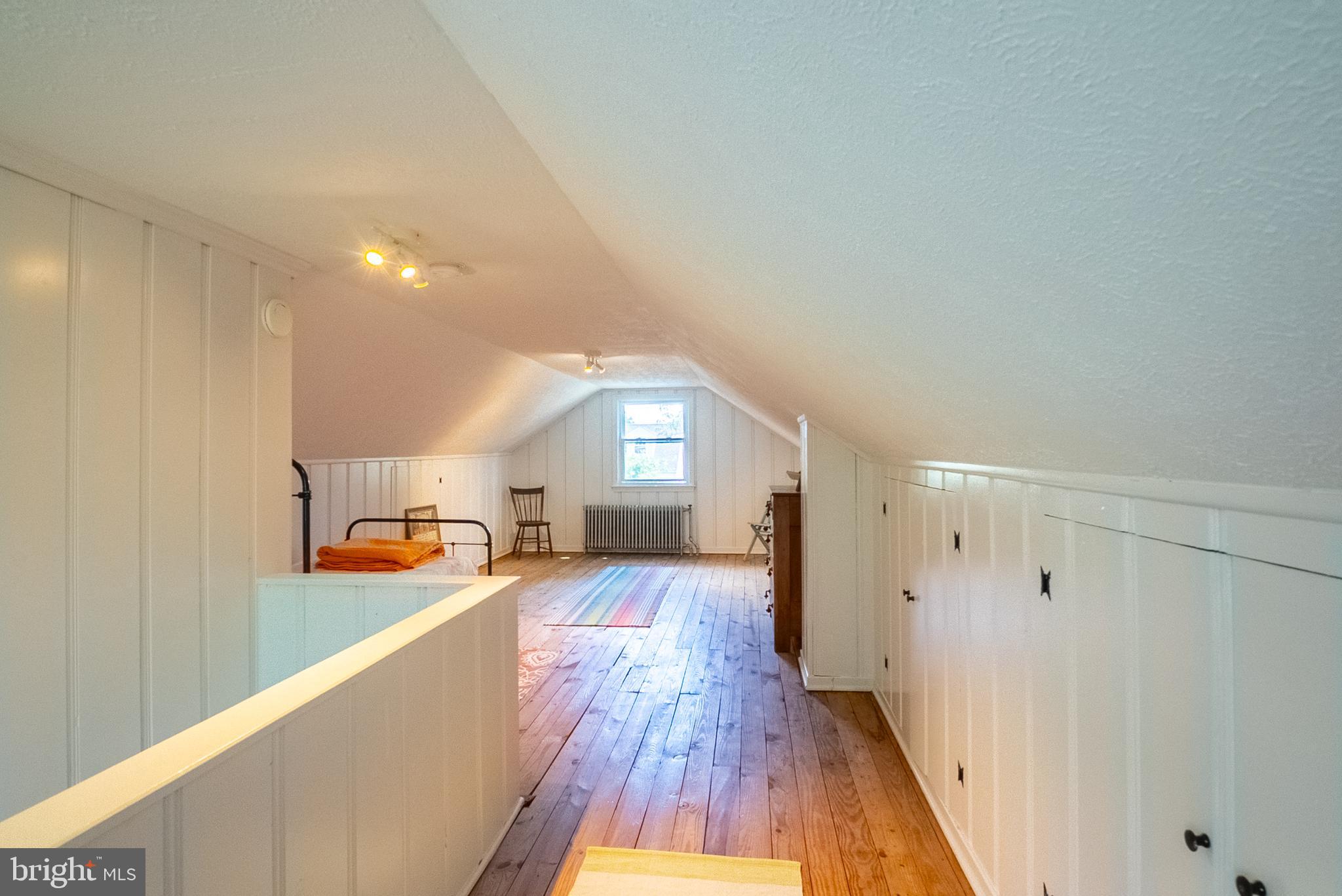 6400 Crestwood Road Baltimore, MD 21239 - Photo 27 of 39 a view of a living room hardwood floor and a kitchen