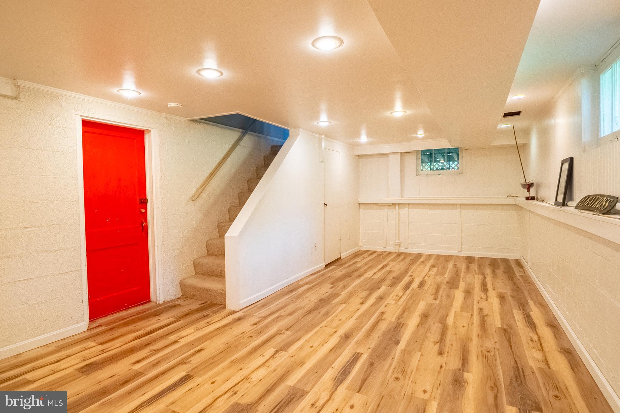 6400 Crestwood Road Baltimore, MD 21239 - Photo 29 of 39 a view of empty room with wooden floor