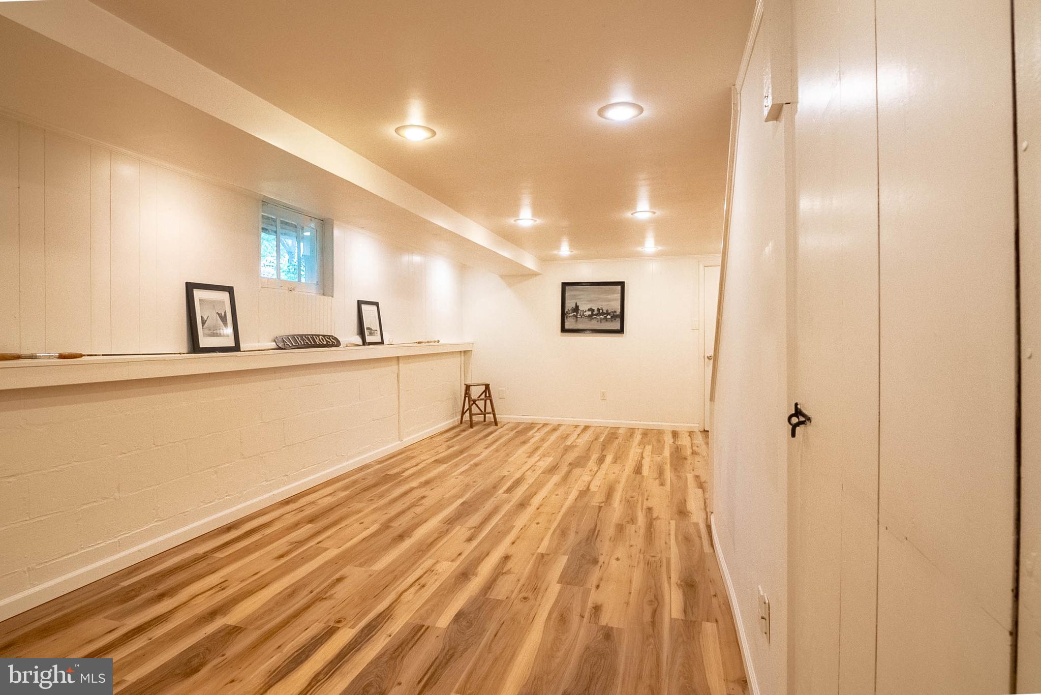 6400 Crestwood Road Baltimore, MD 21239 - Photo 30 of 39 a spacious bathroom with a sink and a mirror