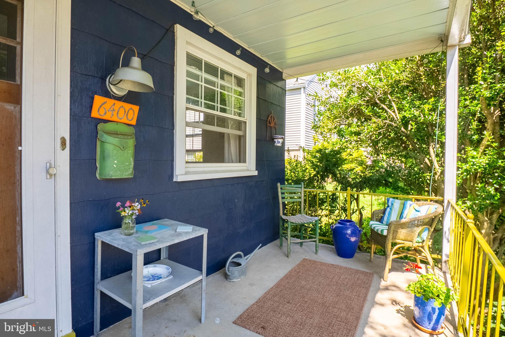 6400 Crestwood Road Baltimore, MD 21239 - Photo 3 of 39 a view of a patio with table and chairs and potted plants