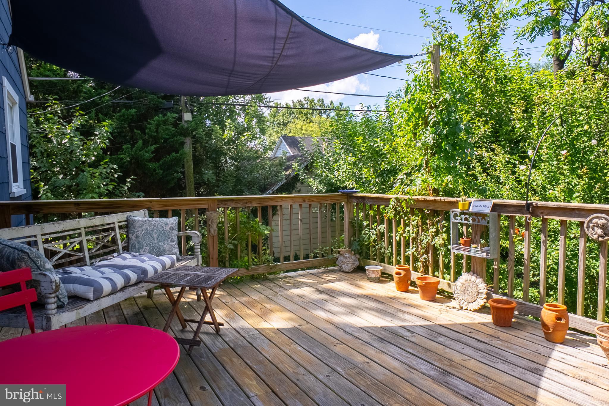 6400 Crestwood Road Baltimore, MD 21239 - Photo 31 of 39 a view of balcony with wooden floor and outdoor seating