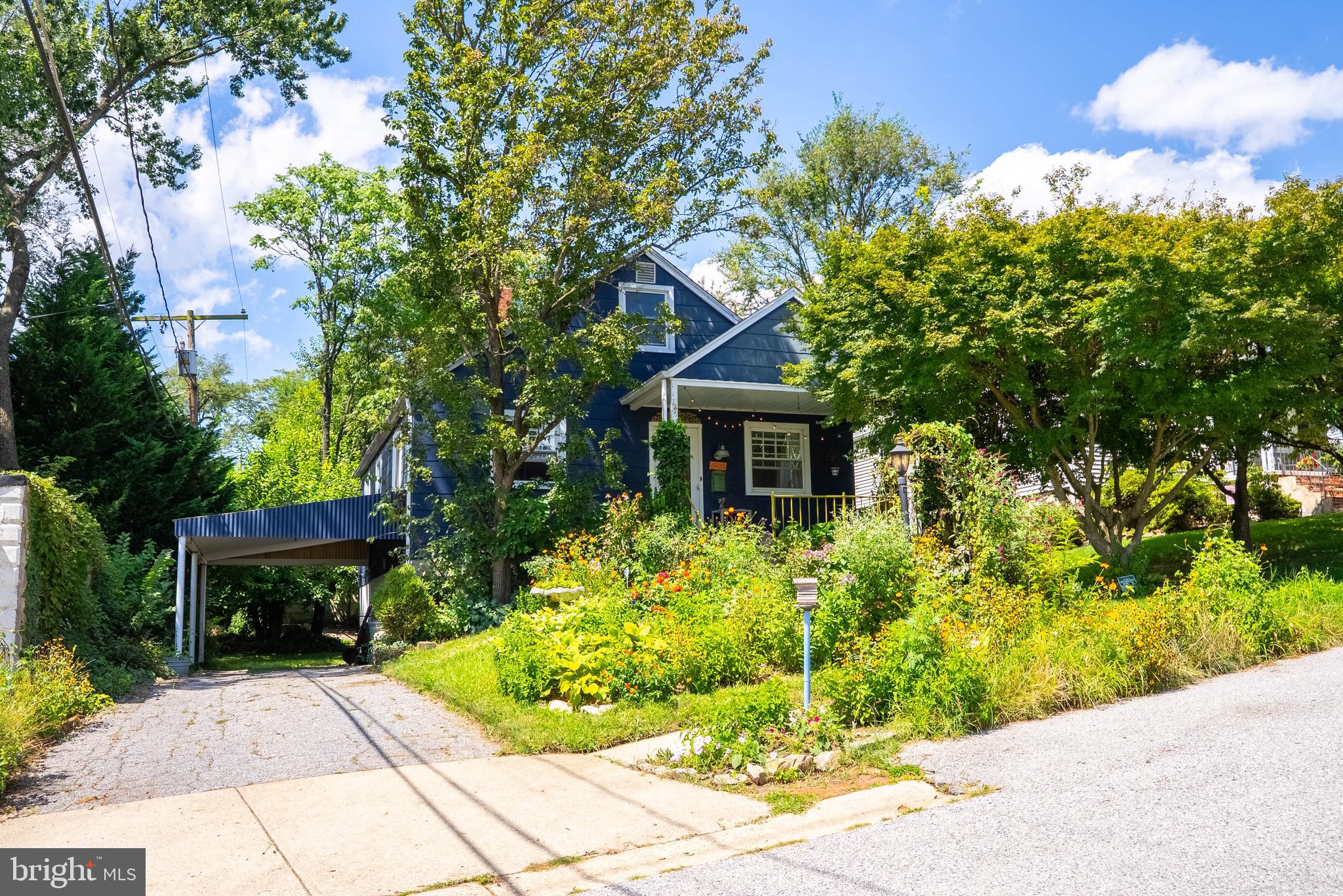 6400 Crestwood Road Baltimore, MD 21239 - Photo 4 of 39 a front view of a house with a yard