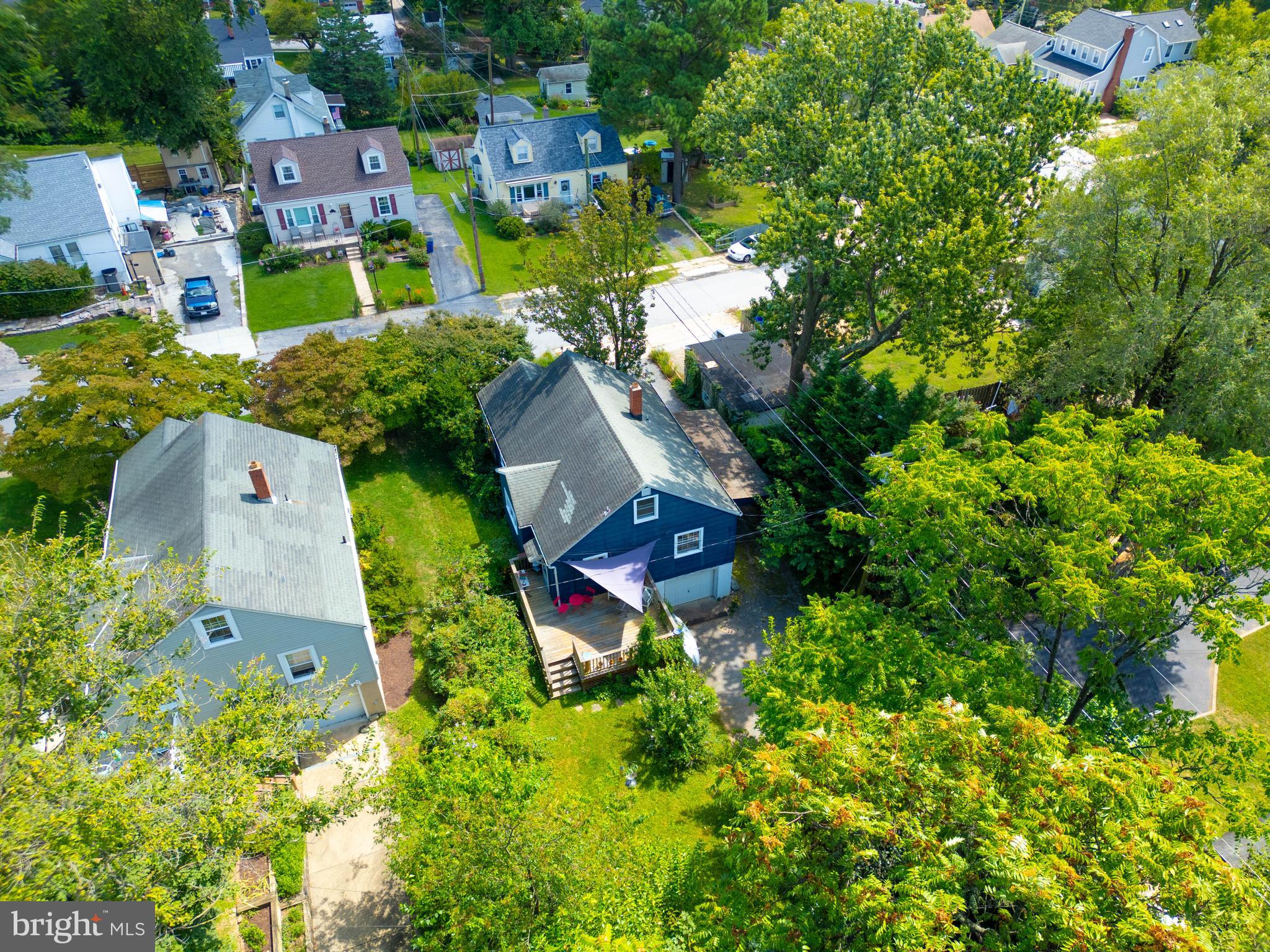 6400 Crestwood Road Baltimore, MD 21239 - Photo 5 of 39 an aerial view of a house with a garden and trees