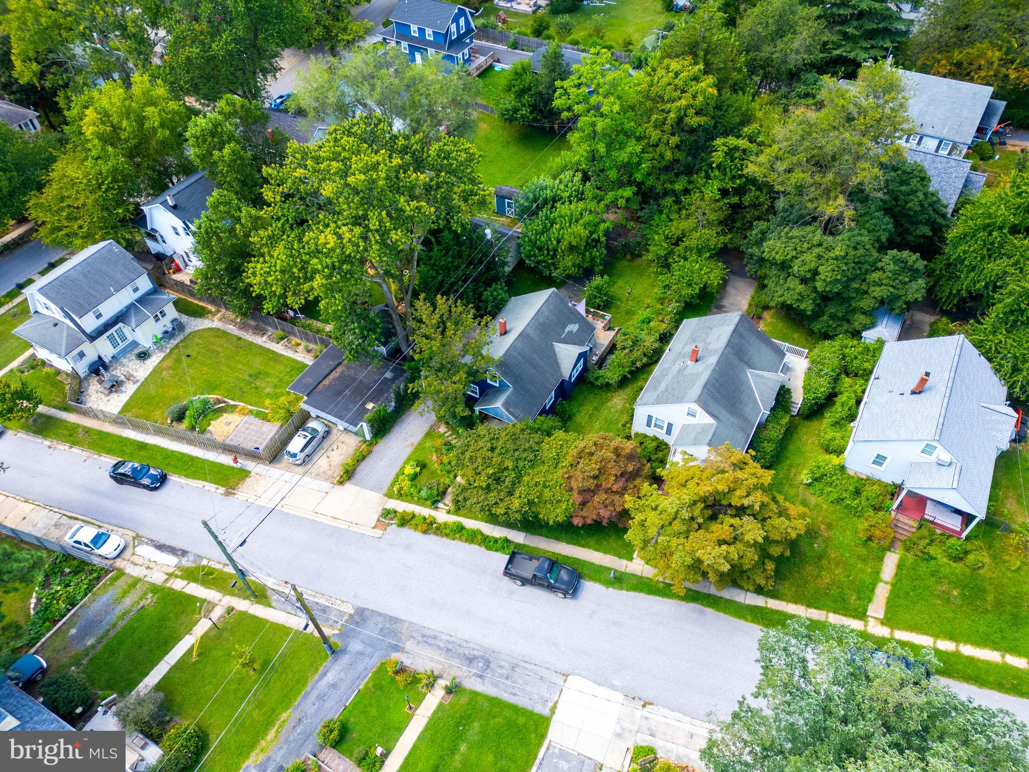 6400 Crestwood Road Baltimore, MD 21239 - Photo 6 of 39 an aerial view of a house with a garden and lots of trees
