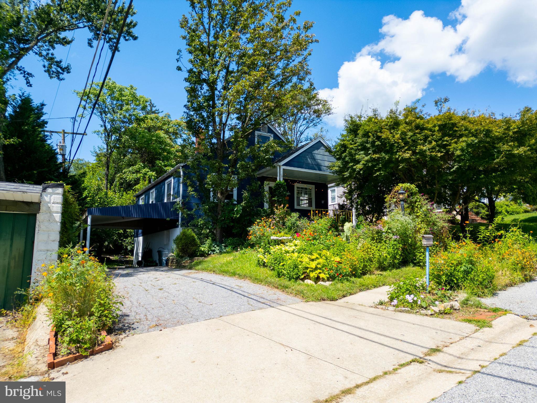 6400 Crestwood Road Baltimore, MD 21239 - Photo 8 of 39 a front view of a house with garden