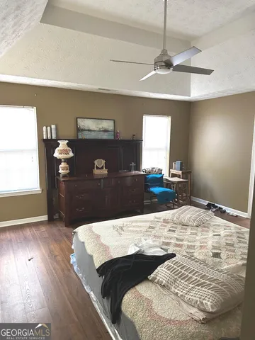 a living room with kitchen island granite countertop furniture and a fireplace