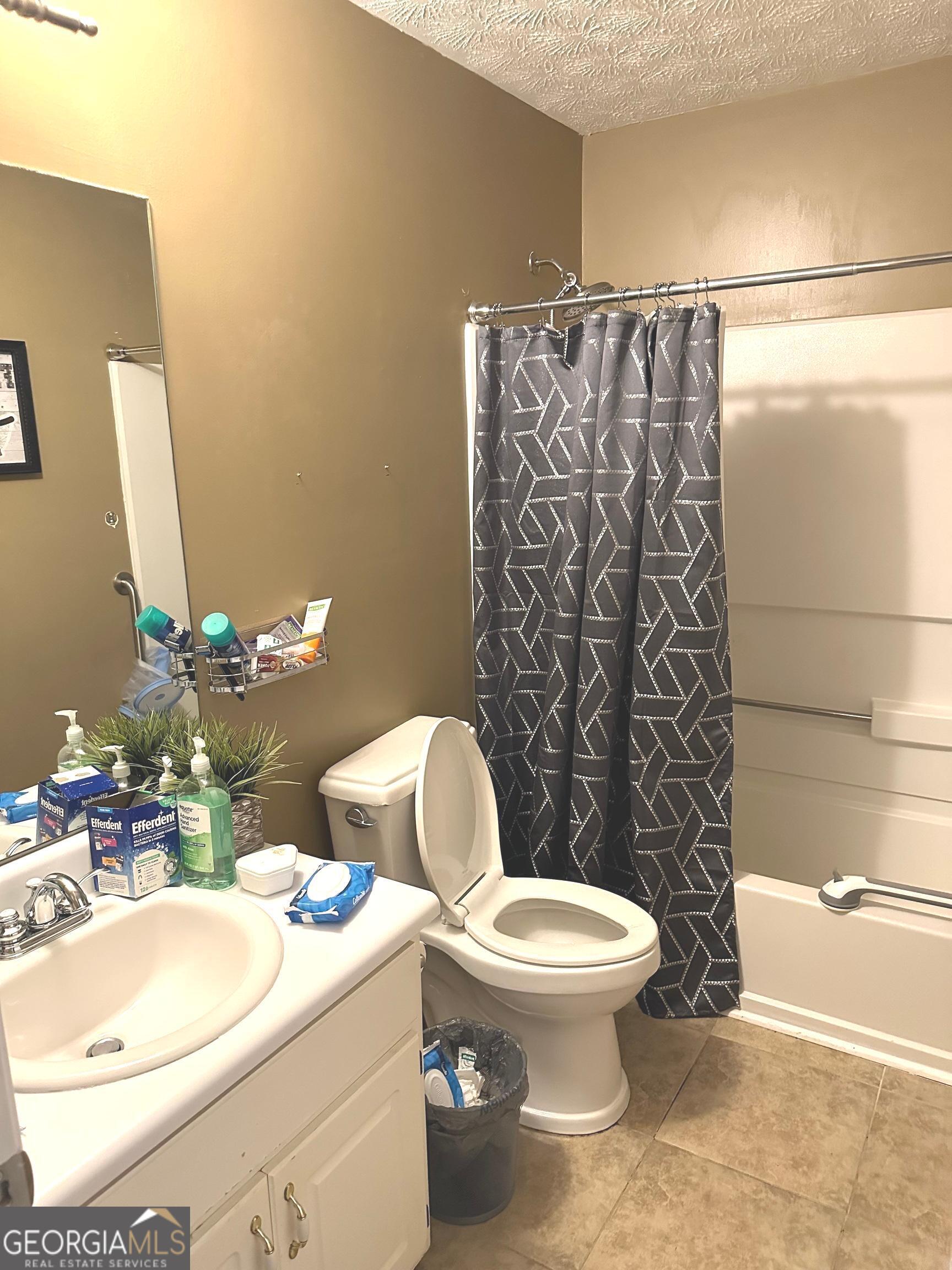 170 Ashley Trace Drive Locust Grove, GA 30248 - Photo 15 of 17 a bathroom with a toilet sink and shower