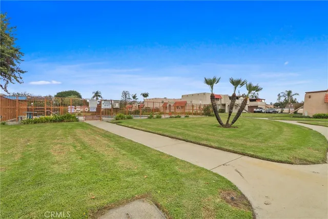 a view of a park with swings and slides