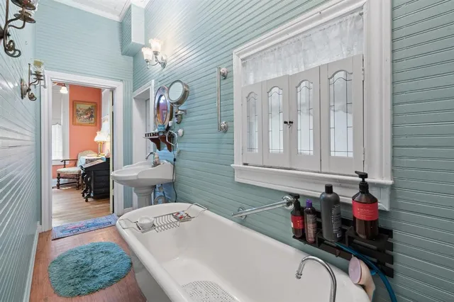 a bathroom with a sink a toilet and a mirror