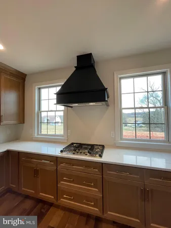 a room with a sink and cabinets