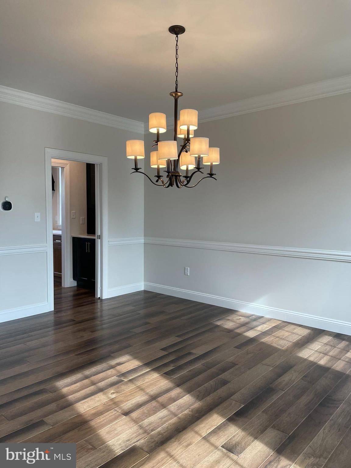 1928 Kimberton Road Phoenixville, PA 19460 - Photo 18 of 32 a view of a hallway with wooden floor and chandelier
