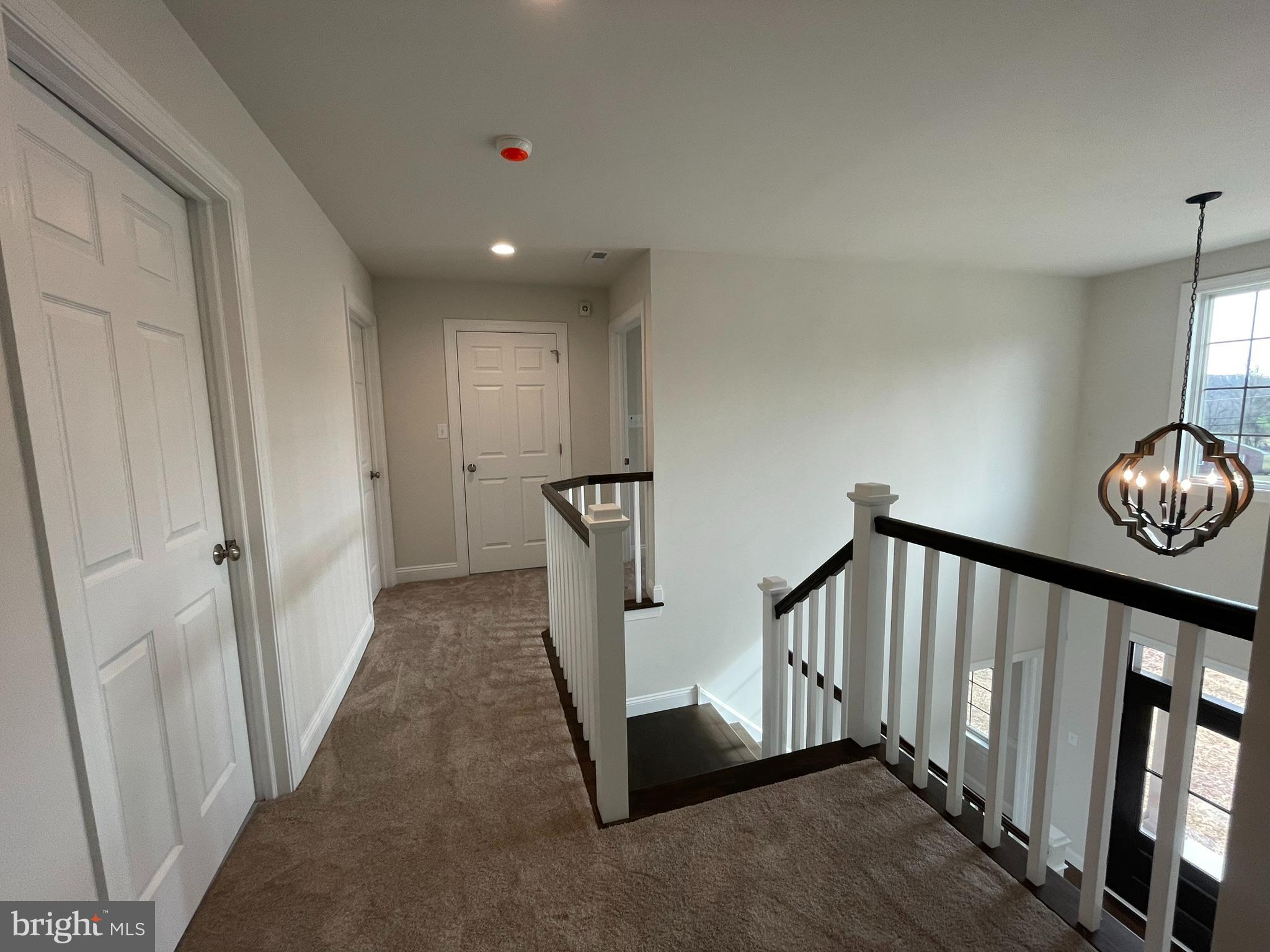 1928 Kimberton Road Phoenixville, PA 19460 - Photo 21 of 32 a view of a hallway with wooden floor and staircase