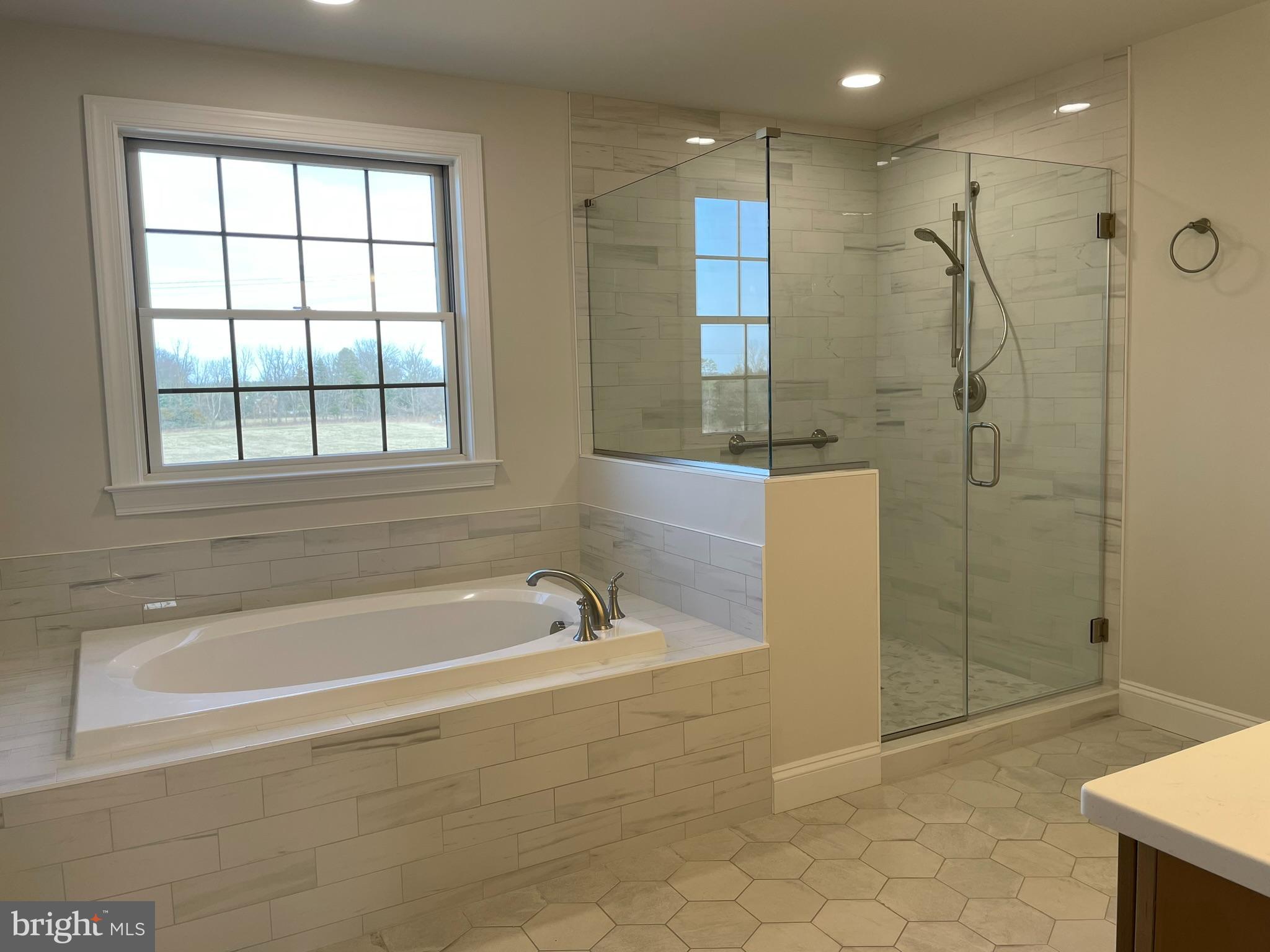 1928 Kimberton Road Phoenixville, PA 19460 - Photo 28 of 32 a spacious bathroom with a bathtub and a shower