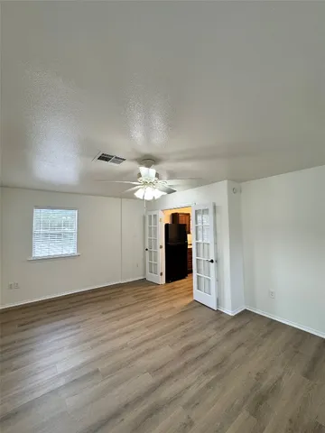 a view of a room with a kitchen