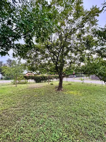 a view of outdoor space with deck and trees