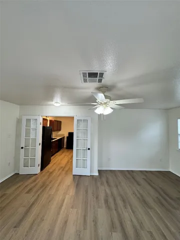 a view of a livingroom with wooden floor
