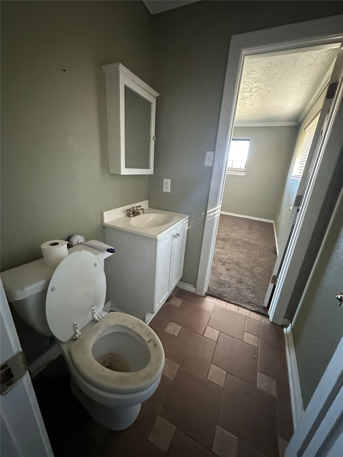 200 Lilley Road Shepherd, TX 77371 - Photo 7 of 9 a bathroom with a toilet sink and mirror