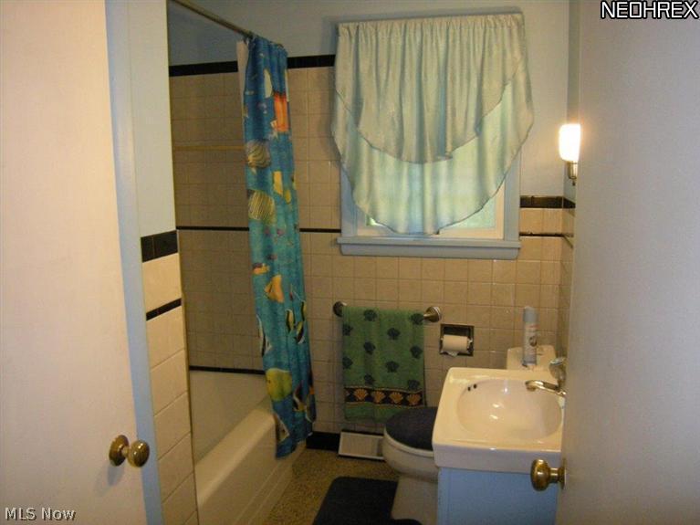 6651 Engle Road Cleveland, OH 44130 - Photo 6 of 20 Bath has linen closet and hand rail in tub for security.