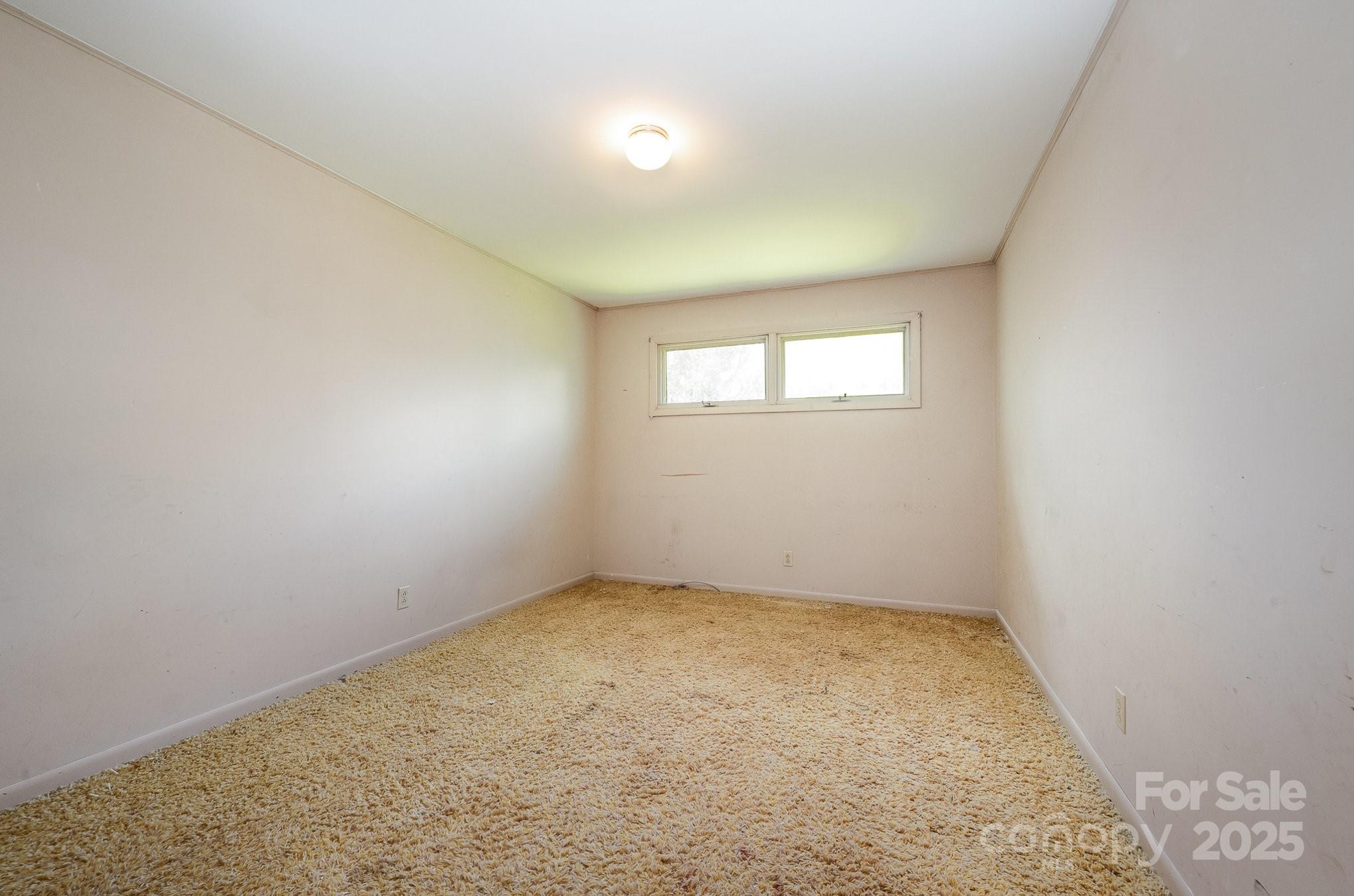 5858 Mundy Road Denver, NC 28037 - Photo 11 of 27 an empty room with a empty space and windows