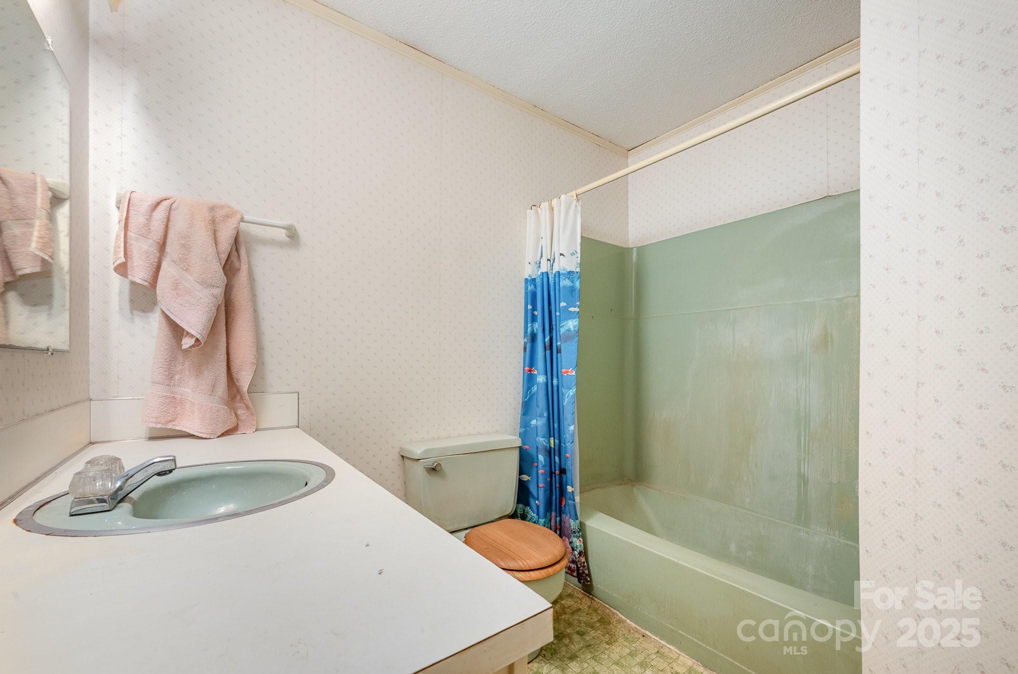 5858 Mundy Road Denver, NC 28037 - Photo 12 of 27 a bathroom with a sink toilet and shower