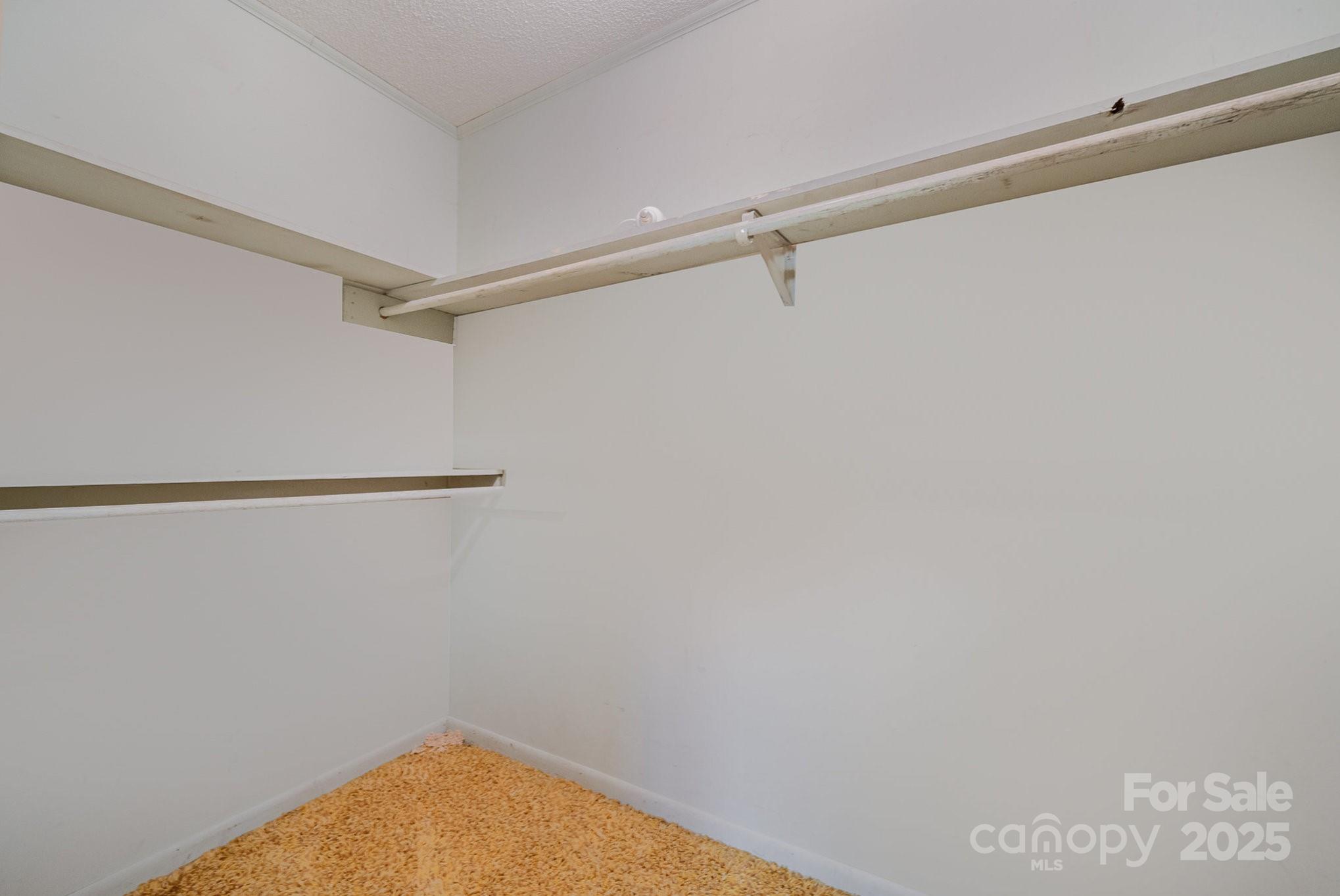 5858 Mundy Road Denver, NC 28037 - Photo 13 of 27 a view of a room with racks on the wall