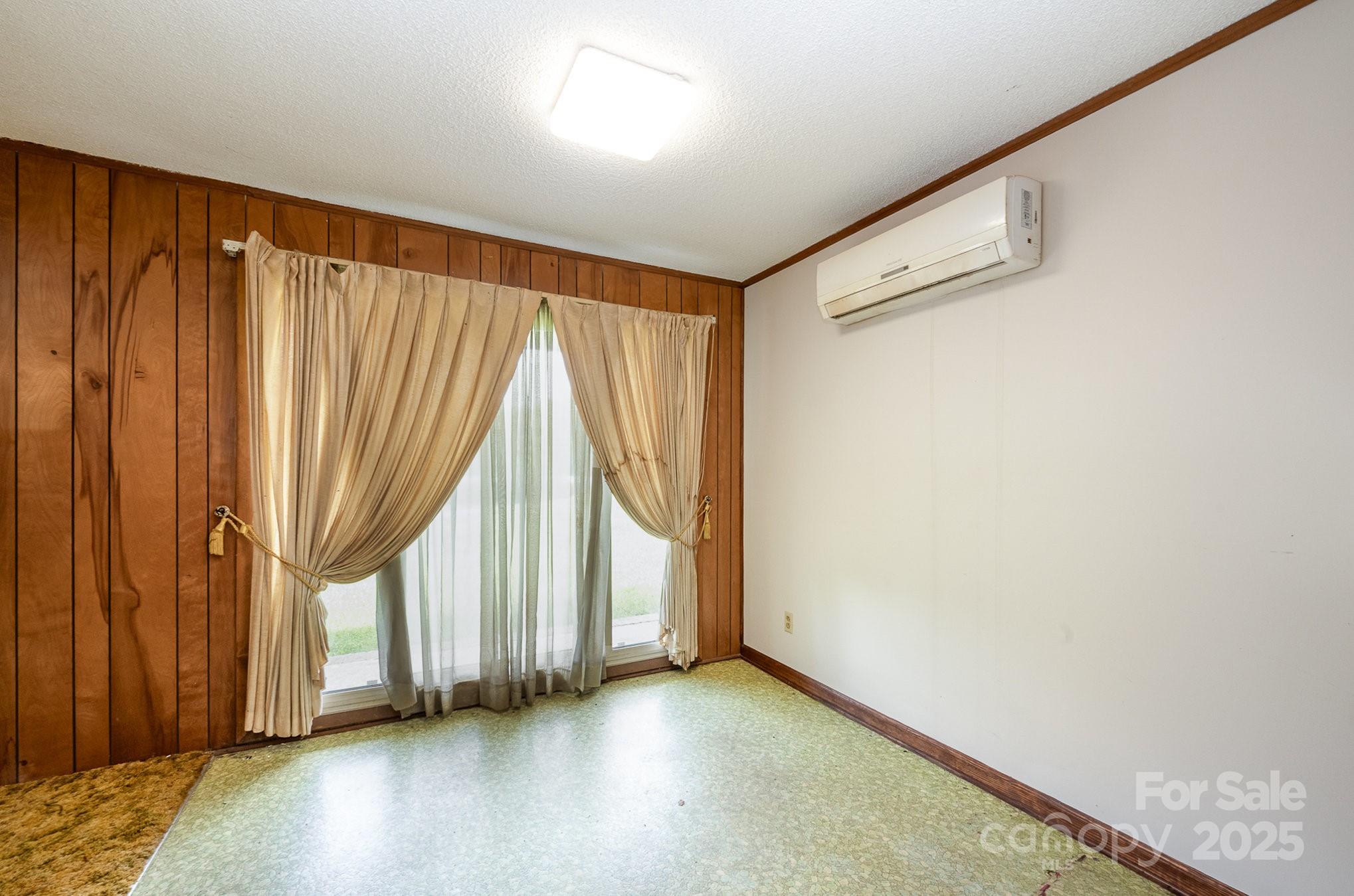 5858 Mundy Road Denver, NC 28037 - Photo 14 of 27 an empty room with wooden floor and windows