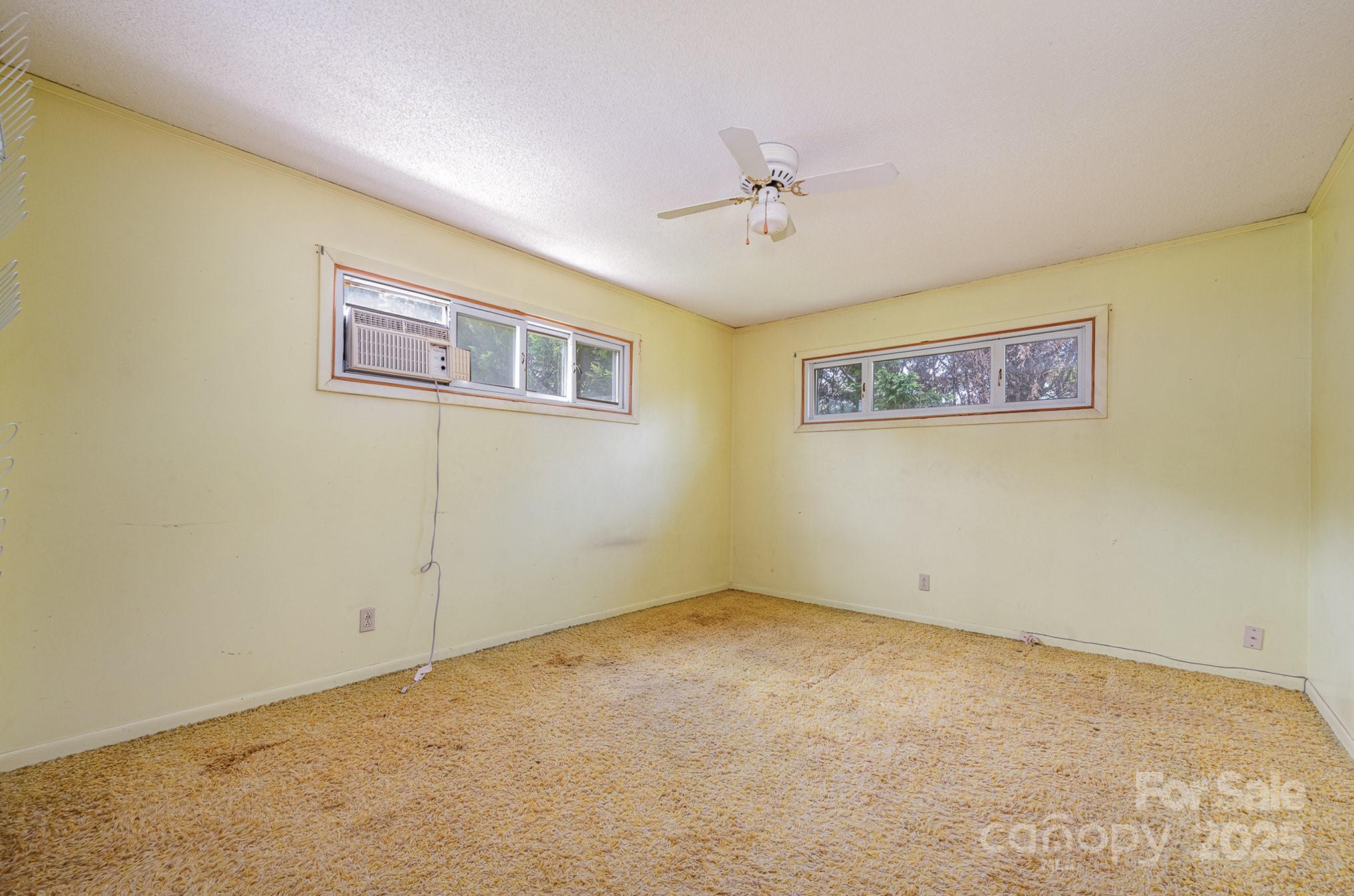 5858 Mundy Road Denver, NC 28037 - Photo 17 of 27 a view of a big room with windows
