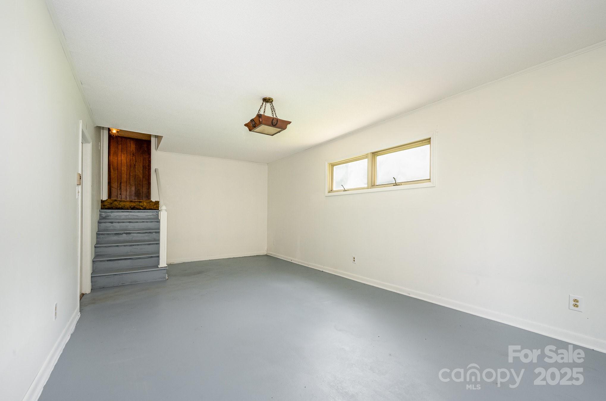 5858 Mundy Road Denver, NC 28037 - Photo 19 of 27 an empty room with a hallway