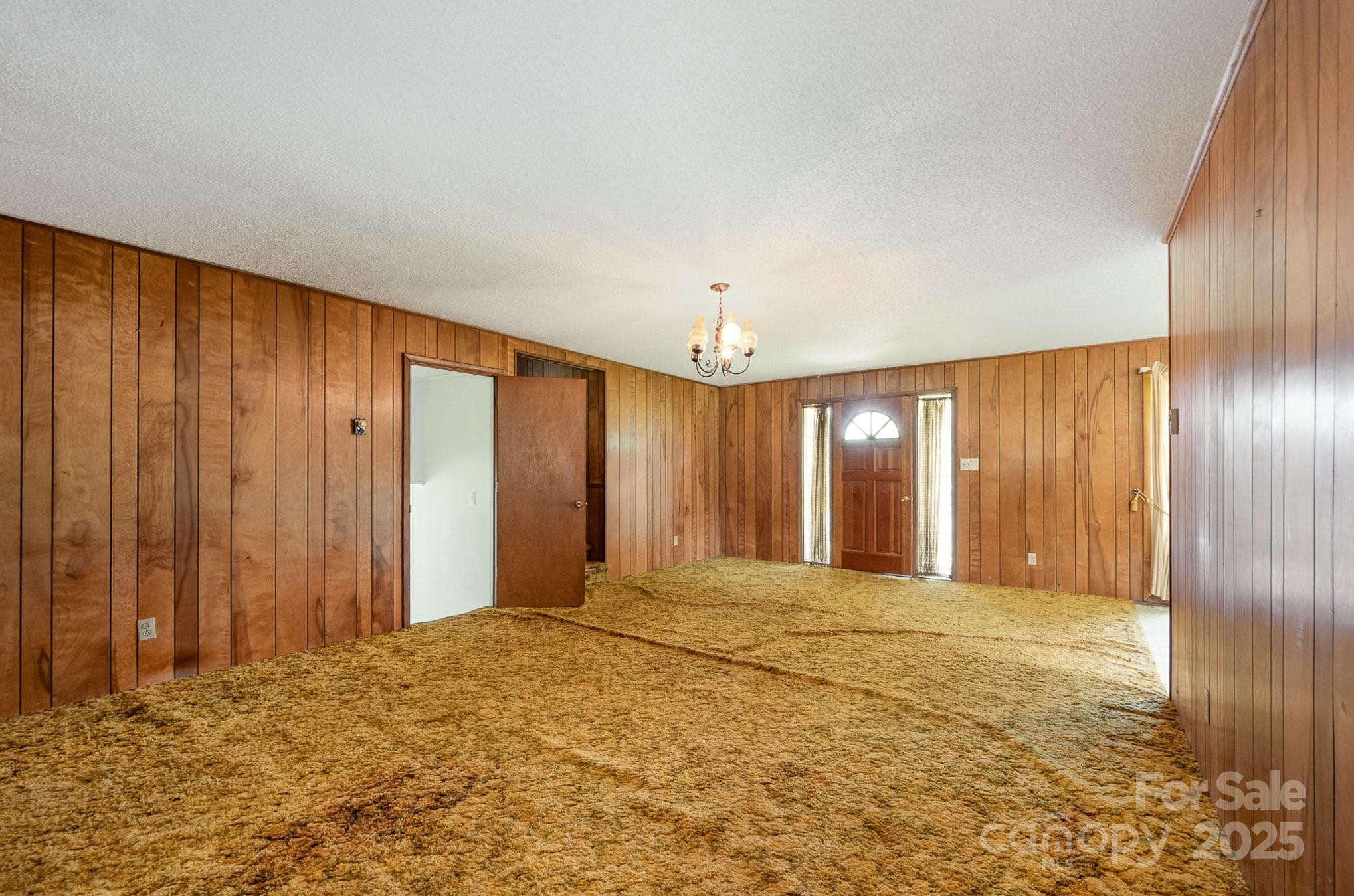 5858 Mundy Road Denver, NC 28037 - Photo 6 of 27 a view of an empty room with a window