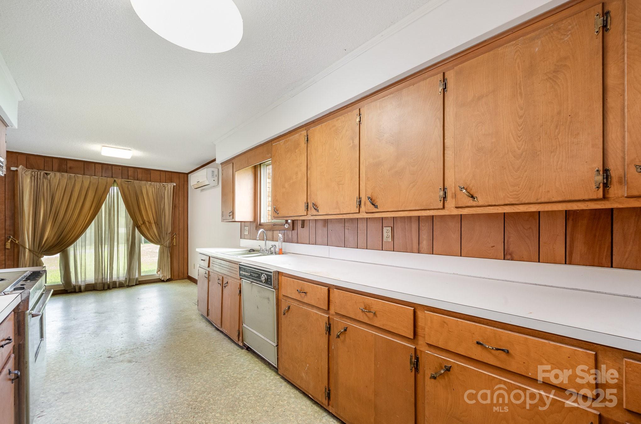 5858 Mundy Road Denver, NC 28037 - Photo 9 of 27 a view of a kitchen with a sink and cabinets