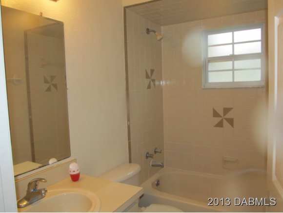 2907 Juniper Drive Edgewater, FL 32141 - Photo 11 of 12 a bath room with a bath tub and a shower