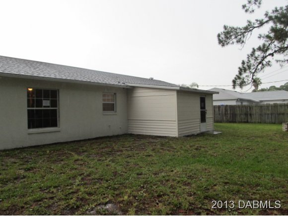 2907 Juniper Drive Edgewater, FL 32141 - Photo 2 of 12 a view of a backyard