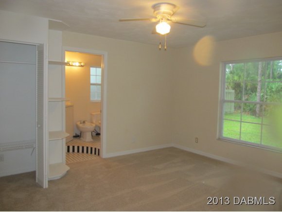 2907 Juniper Drive Edgewater, FL 32141 - Photo 7 of 12 an empty room with windows