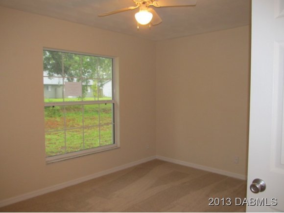 2907 Juniper Drive Edgewater, FL 32141 - Photo 9 of 12 an empty room with a window